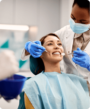 Dentist at Annandale Dental Care beside the treatment chair